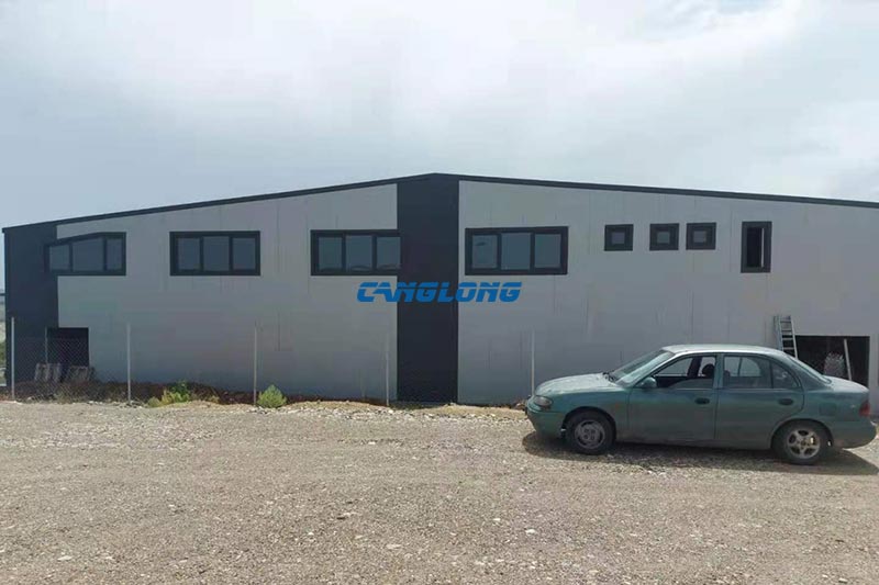 Two-storey office corner with an upper window band on the steel warehouse in Bitola