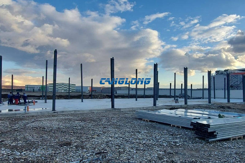 Steel columns erected on the concrete slab during industrial plant construction in Skopje, North Macedonia