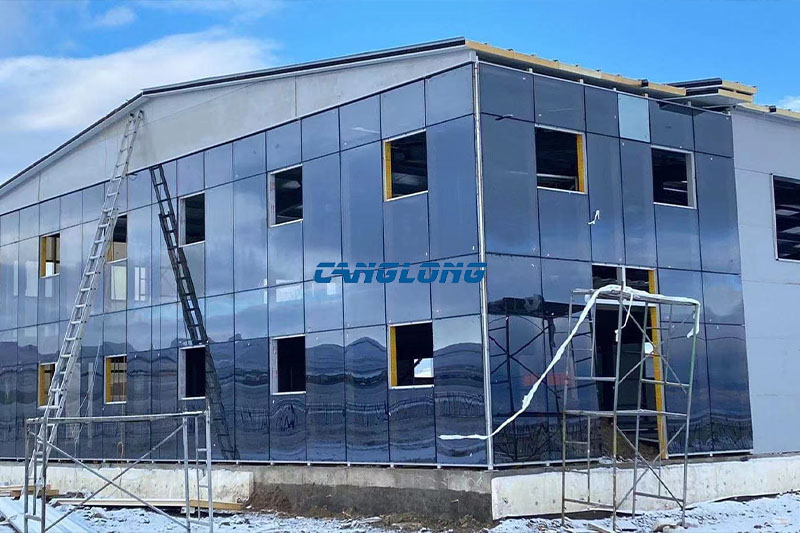 Nearly completed steel structure workshop building with glass curtain wall office elevation in Ulaanbaatar, Mongolia