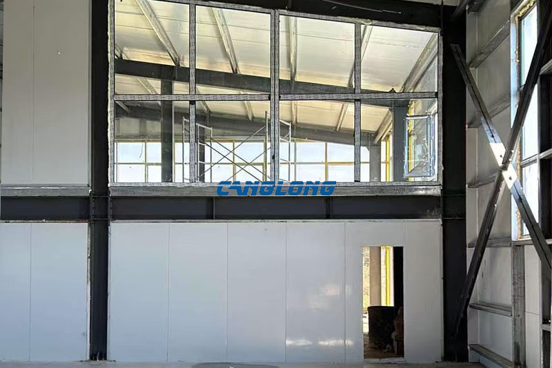 Steel frame interior with purlins and bracing at a prefabricated mining industry building in Mongolia